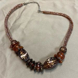 3/$20 Necklace with rusty red and golden tone beads with 3 strands of seed beads